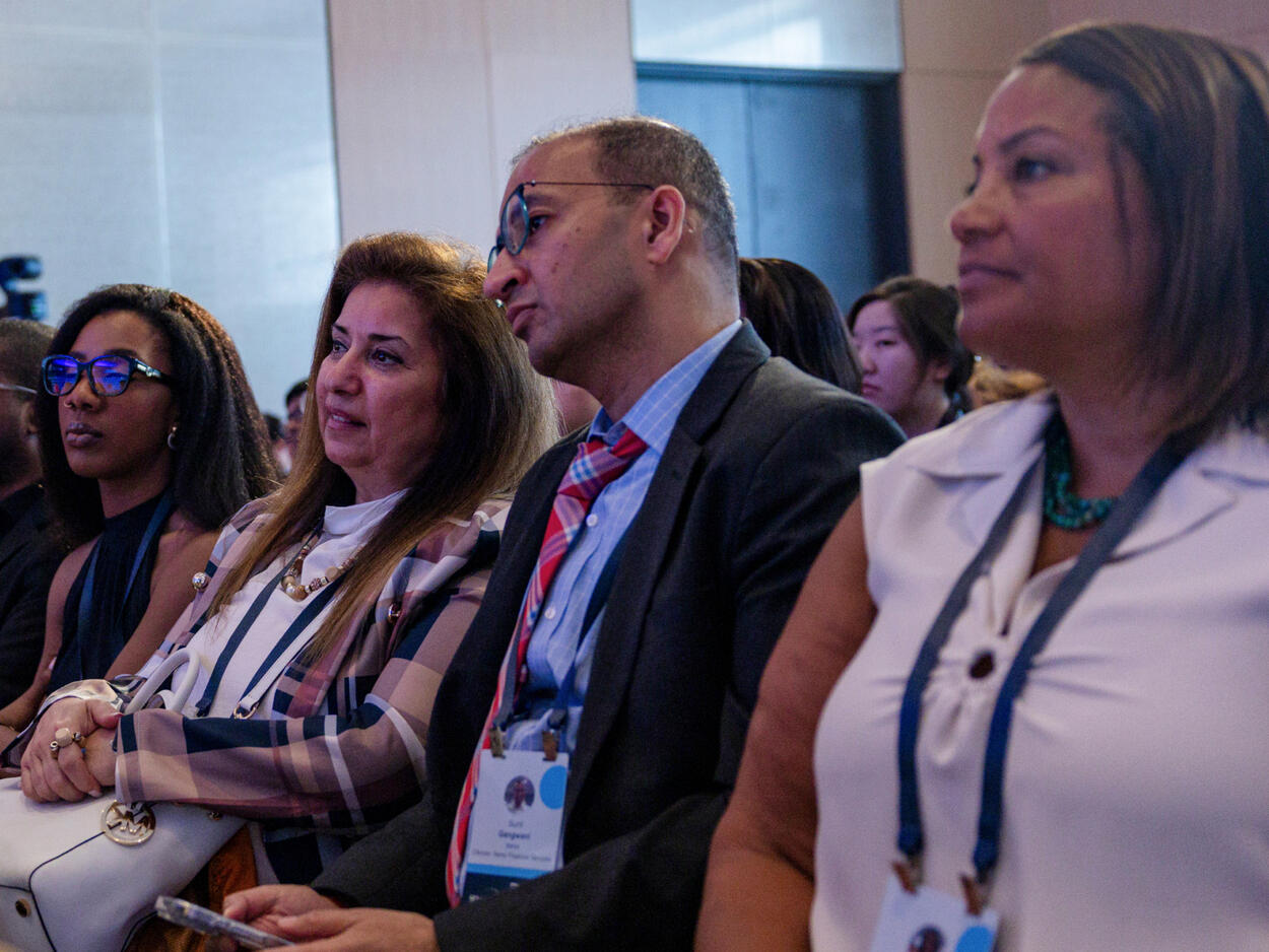 Attendees seated in an audience, at a Semafor World Economy session